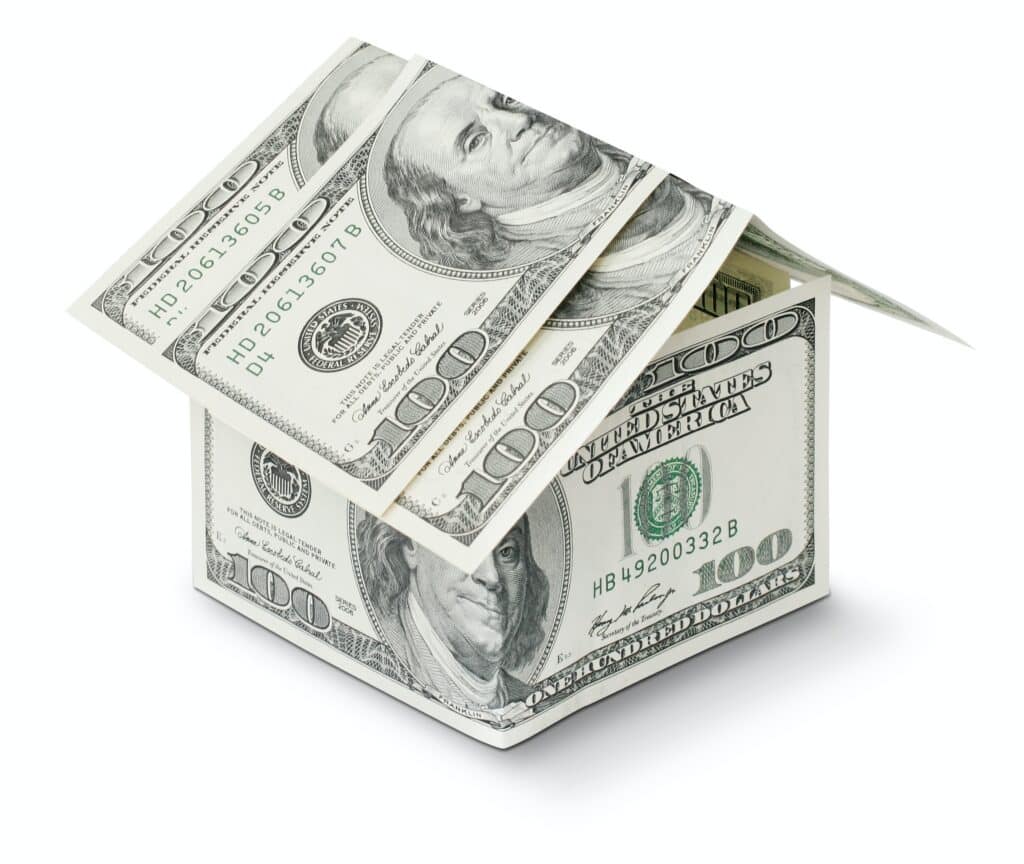 Crisp 100 dollar bills formed to shape a house