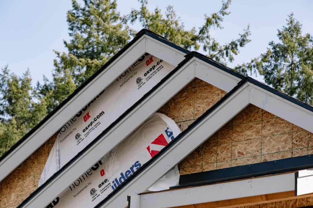 Image of roofline for single gamily home under construction, featuring drip edge and trim